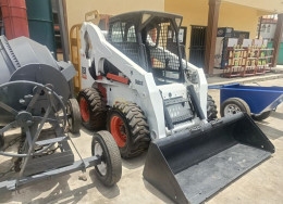 Bobcat with hydraulic Jack Hammer